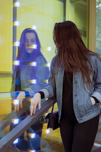 Young woman standing in city