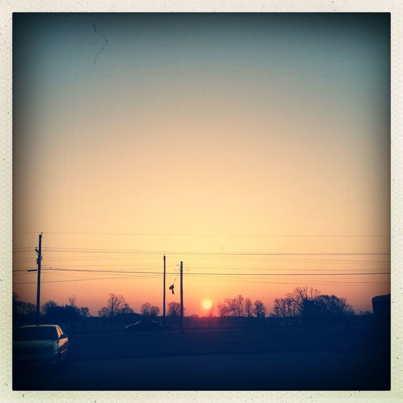 sunset, clear sky, power line, electricity pylon, copy space, silhouette, orange color, electricity, sun, transfer print, power supply, tranquil scene, tranquility, scenics, beauty in nature, nature, connection, auto post production filter, fuel and power generation, landscape