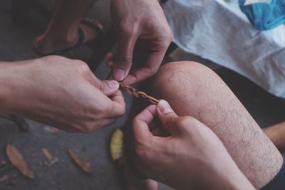 Close-up of man holding hands