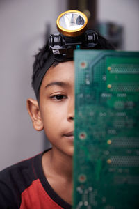 Close-up portrait of boy looking away