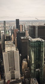 High angle view of buildings in city against sky