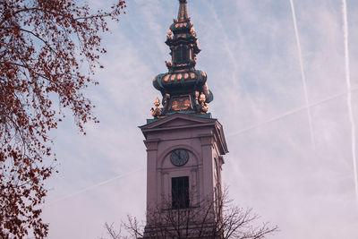 Low angle of a church clock tower