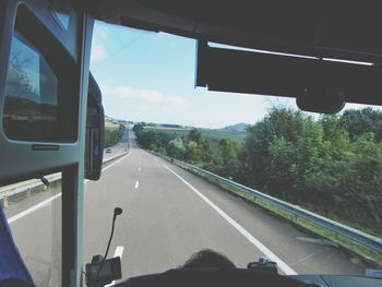 Close-up of car moving on road