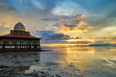 Scenic view of sea against sky at sunset