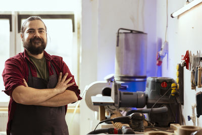 Portrait of man working at workshop