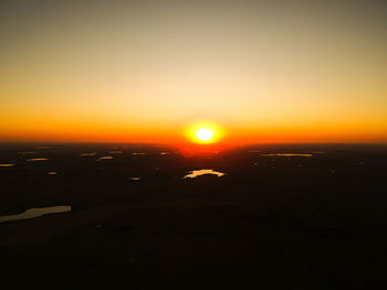 Scenic view of sunset over city