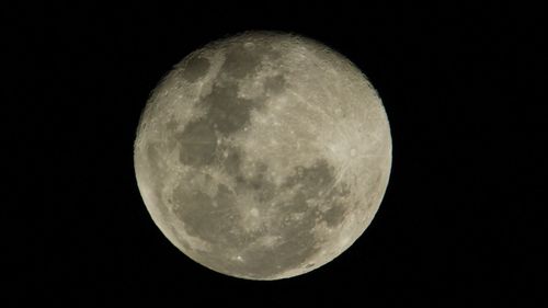 Scenic view of moon against sky at night