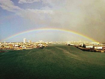 View of rainbow over city
