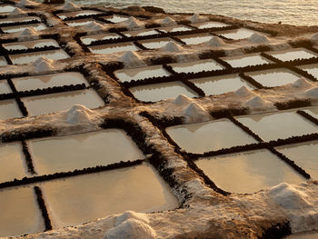 Amazing scenery of salt flats located near sea at sunset in la palma in spain