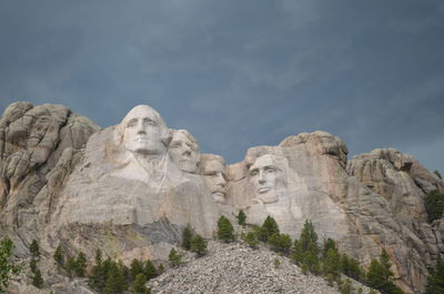 Low angle view of statue against sky