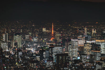 Illuminated buildings in city at night