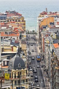 High angle view of city buildings by sea