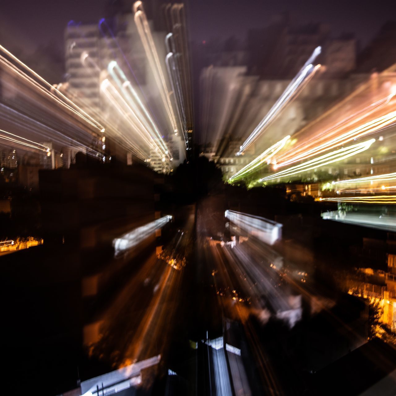 LIGHT TRAILS ON ROAD IN CITY