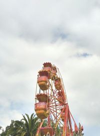 Low angle view of ferris wheel against sky