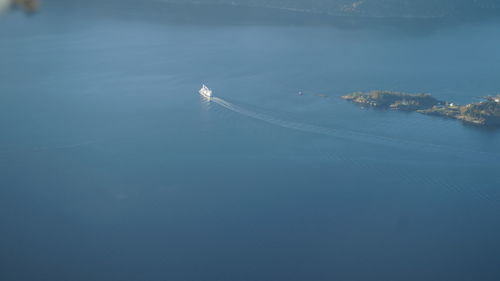 High angle view of sea against blue sky