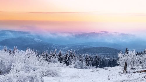 Scenic view of snow covered mountains