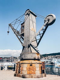 Traditional windmill against sky in city