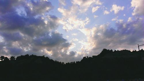 Scenic view of mountains against cloudy sky