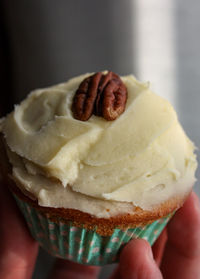 Close-up of hand holding ice cream