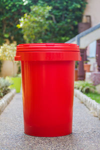 Close-up of red juice on footpath