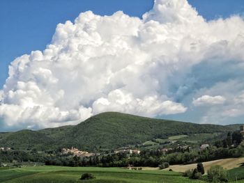 Scenic view of landscape and mountains against sky