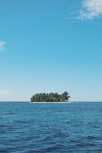 Scenic view of sea against blue sky