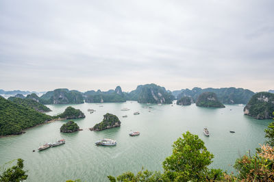 High angle view of boats in sea against sky