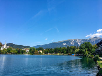 Scenic view of lake against blue sky