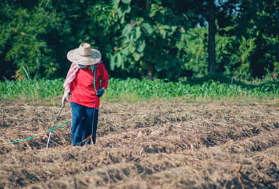 Full length of man working on field