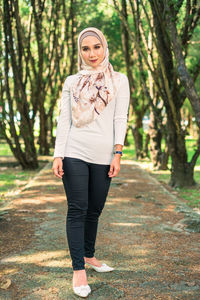 Full length portrait of young woman