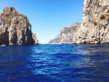 Scenic view of sea against clear blue sky