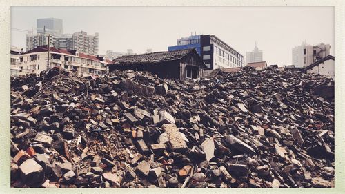 Stack of roof against buildings in city