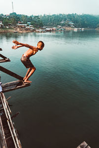 Man jumping in lake