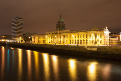 Reflection of building in water at night