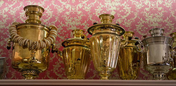 Close-up of glass bottles on wall