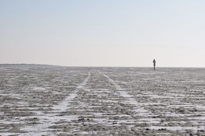 Scenic view of sea against clear sky during winter