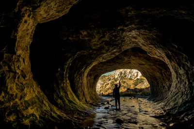 High angle view of man standing in cave