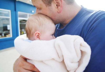 Close-up of father holding baby