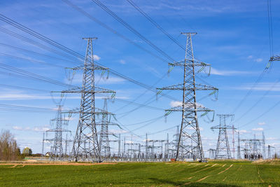 High voltage electricity pylons, transmission power lines, and distribution substations