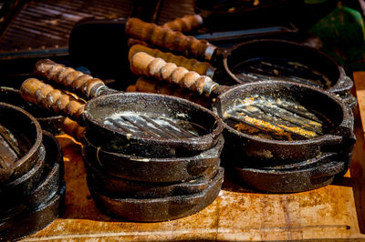 Stack of cooking utensils on table at restaurant