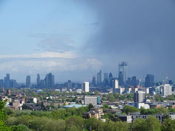 Buildings in city against sky