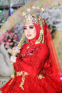 Beautiful bride looking away during wedding ceremony