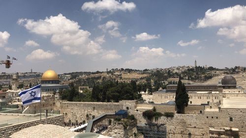 Panoramic view of buildings in city against sky