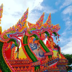 Low angle view of multi colored temple against sky