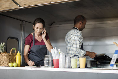 Vendors working in food truck