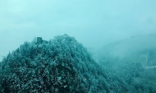 Scenic view of mountains during foggy weather