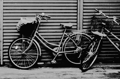 Bicycle parked against wall