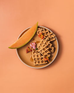 High angle view of food in plate on yellow background