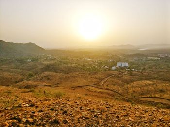 Scenic view of landscape against sky during sunset