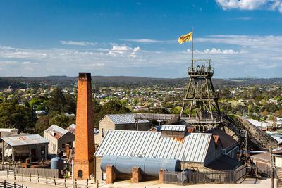 View of townscape against cloudy sky